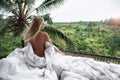 Healthy sleep in the open air. woman relaxing at villa, beautiful view