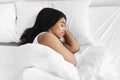 Healthy sleeping. Young african american woman sleeping in her bed at home, copy space, top view Royalty Free Stock Photo