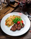 grilled meat and couscous on wood table Royalty Free Stock Photo