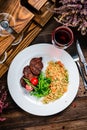 grilled meat and couscous on wood table Royalty Free Stock Photo