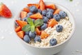 Healthy smoothie bowl with granola, fresh strawberries, blueberries, bananas, yogurt and mint. Royalty Free Stock Photo