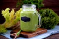 Healthy smoothies in mason jar from spinach, cucumber, celery, apple, parsley with olive oil, Himalayan rose salt and mineral wate Royalty Free Stock Photo