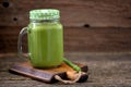 Healthy smoothies in mason jar from spinach, cucumber, celery, apple, parsley with olive oil, Himalayan rose salt and mineral wate Royalty Free Stock Photo