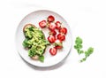 Healthy snack, breakfast - sandwich with avocado and fresh strawberries on a light background, top view Royalty Free Stock Photo