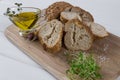 Healthy snack. Cereals bread, olive oil with herb spicy and garlic.Fresh cress salad.