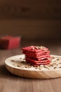Healthy snack cracker or biscuit with seeds and beetroot top view on a stone plate with oat flakes on wooden background, healthy Royalty Free Stock Photo
