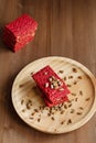 Healthy snack cracker or biscuit with seeds and beetroot top view on a stone plate with oat flakes on wooden background, healthy Royalty Free Stock Photo