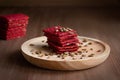 Healthy snack cracker or biscuit with seeds and beetroot top view on a stone plate with oat flakes on wooden background, healthy Royalty Free Stock Photo