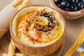 Healthy snack from crispbread with hummus, olive oil and black olives