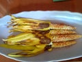 Healthy snack of four barbeque baby corns