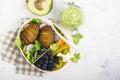 Healthy snack in a lunch box: Golden baked potatoes, salad, blueberries, green pepper, cauliflower, radish in a plastic Royalty Free Stock Photo