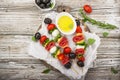 Healthy snack: mouth-watering kebabs on a picnic with tomatoes, mozzarella, salami, black olives, Basil, tortellini Royalty Free Stock Photo