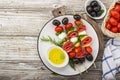 Healthy snack: mouth-watering kebabs on a picnic with tomatoes, mozzarella, salami, black olives, Basil, tortellini Royalty Free Stock Photo