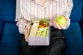 Healthy snack for office worker. Woman hands with lunch box at workplace during lunch break. Container food at work desk Royalty Free Stock Photo