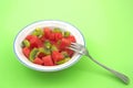 A healthy snack served in a bowl of chopped fruit