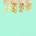 Healthy snack, set of dried fruits. Dehydrated fruit chips of apple, banana, persimmon, pear in paper package Royalty Free Stock Photo