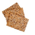 Healthy snack, wholemeal, wholewheat crackers with sunflower, linseed and sesame seeds. Isolated on white background.