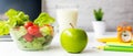 Healthy snack with working in office.  Green apple and fresh salad with water for diet Health Plan Royalty Free Stock Photo