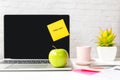 Healthy snack with working in office.  Green apple and fresh water for diet Health Plan with laptop on white dress working Royalty Free Stock Photo