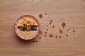 Healthy snacks in bowl: yoghurt, oat flakes, fruit, chia and goji seeds Royalty Free Stock Photo