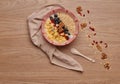 Healthy snacks in bowl: yoghurt, oat flakes, fruit, chia and goji seeds
