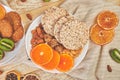 Healthy snacks -  variety oat granola bar,  rice crips, almond,  kiwi, dried orange Royalty Free Stock Photo