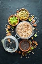 Healthy snacks in a wooden box. oatmeal bars, croissant, raisins, nuts. Top view. Royalty Free Stock Photo