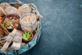Healthy snacks in a wooden box. oatmeal bars, croissant, raisins, nuts. Top view. Royalty Free Stock Photo