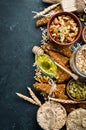 Healthy snacks in a wooden box. oatmeal bars, croissant, raisins, nuts. Top view. Free space Royalty Free Stock Photo