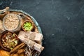 Healthy snacks in a wooden box. oatmeal bars, croissant, raisins, nuts. Top view. Royalty Free Stock Photo