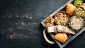 Healthy snacks in a wooden box. oatmeal bars, croissant, raisins, nuts. Top view. Royalty Free Stock Photo