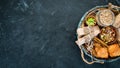 Healthy snacks in a wooden box. oatmeal bars, croissant, raisins, nuts. Top view. Royalty Free Stock Photo