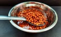 healthy soaked black grams in bowl on black background closeup image