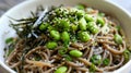 Healthy soba noodles with edamame and microgreens in a ceramic bowl