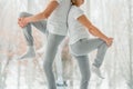 Healthy and sport concept. Senior couple standing back to back and doing stretching Royalty Free Stock Photo