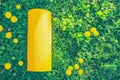 Healthy sport lifestyle background with rolled yellow yoga mat on grass with dandelions Royalty Free Stock Photo