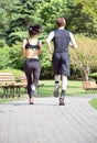 Healthy sports people trail running living an active life. Happy lifestyle couple of athletes training cardio together in summer Royalty Free Stock Photo