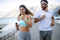 Healthy sporty lifestyle. Happy fit people friends exercising and running outdoor Royalty Free Stock Photo