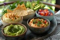 Healthy Spread: Hummus, Guacamole, and Snacks on Patterned Cloth. Concept Healthy Eating, Appetizer