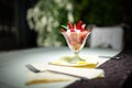 Healthy strawberries and cream refreshing light dessert.Whipping cream with strawberry pieces served in elegant glass cup.Homemade Royalty Free Stock Photo