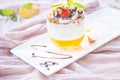 Healthy strawberry, peach and walnut parfait in a glass on a white background Royalty Free Stock Photo