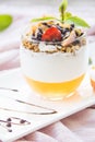 Healthy strawberry, peach and walnut parfait in a glass on a white background Royalty Free Stock Photo