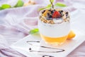 Healthy strawberry, peach and walnut parfait in a glass on a white background Royalty Free Stock Photo