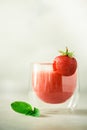 Healthy strawberry smoothie in glass on gray background with copy space. Banner. Summer food and clean eating concept Royalty Free Stock Photo