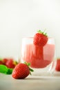 Healthy strawberry smoothie in glass on gray background with copy space. Banner. Summer food and clean eating concept Royalty Free Stock Photo