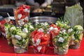 Healthy street food vegetables salad in plastic cups Royalty Free Stock Photo