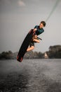 healthy strong guy doing an extreme jump on wakeboard Royalty Free Stock Photo