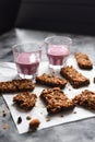 Healthy sugar free gluten free snack. Energetic granola bars with oats, almonds and amaranth seeds served with blueberry smoothie Royalty Free Stock Photo