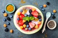 Healthy summer breakfast concept, fruit salad in carved watermelon. Watermelon bowl with yogurt, chia seeds, fresh berries Royalty Free Stock Photo