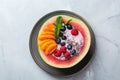Healthy summer breakfast with fruit salad and yogurt in watermelon Royalty Free Stock Photo